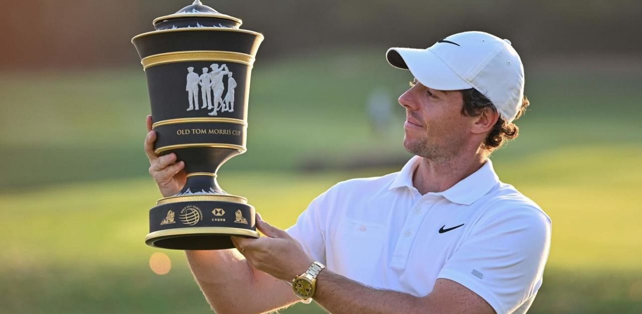 Rory McIlroy of Northern Ireland poses with his trophy after winning in the WGC-HSBC Champions golf tournament in 2019. Credits: AFP