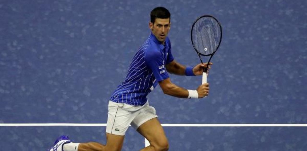 Novak Djokovic of Serbia returns a volley during his Men's Singles first round match. Credit: AFP