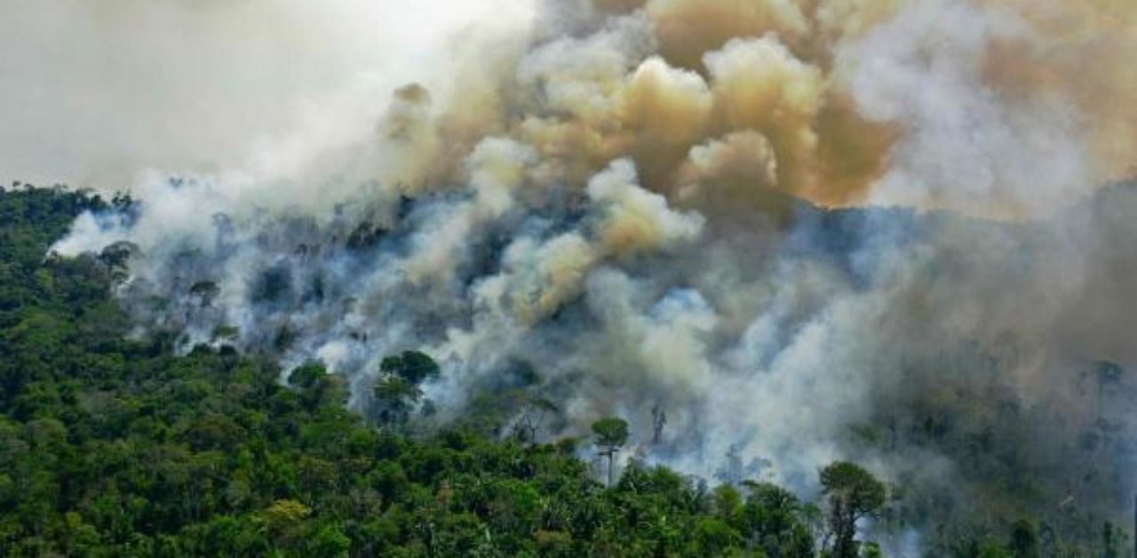 An area of Amazon rainforest reserve burning south of Novo Progresso, in Para state, Brazil. Credit: AFP Photo