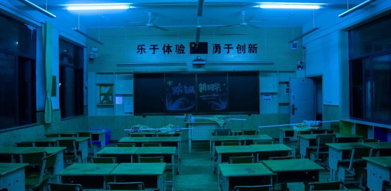 A classroom being disinfected by an automatic ultraviolet disinfection system at an elementary school in Wuhan. Credit: AFP Photo