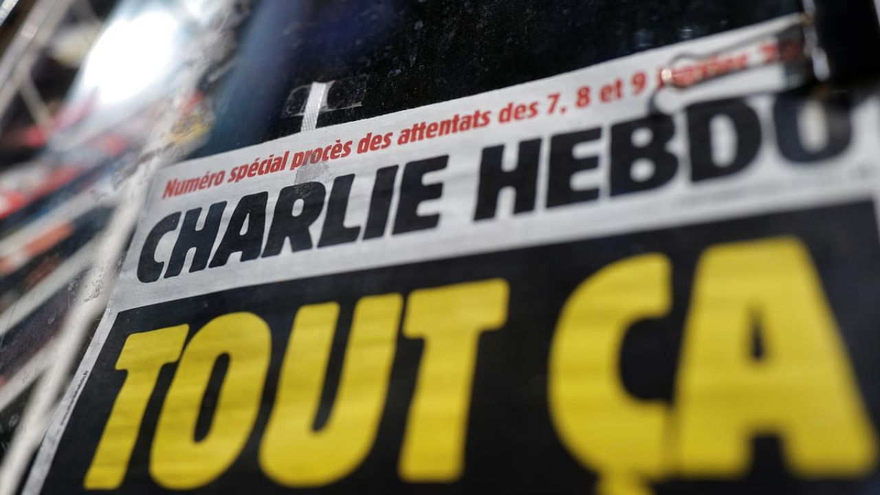 The front page of French satirical magazine Charlie Hebdo is seen at a newspapers kiosk in Paris on the opening day of the trial of the January 2015 Paris attacks against Charlie Hebdo satirical weekly. Credit: Reuters