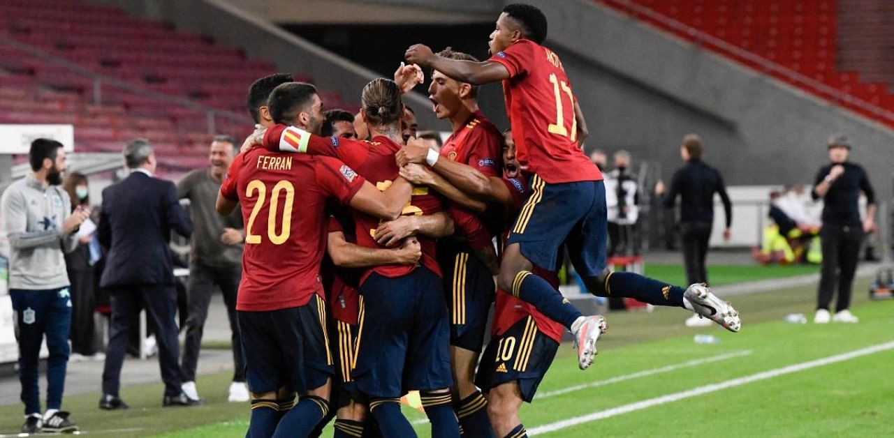 Spain's players celebrate after scoring during the UEFA Nations League football match between Germany and Spain in Stuttgart. Credits: AFP