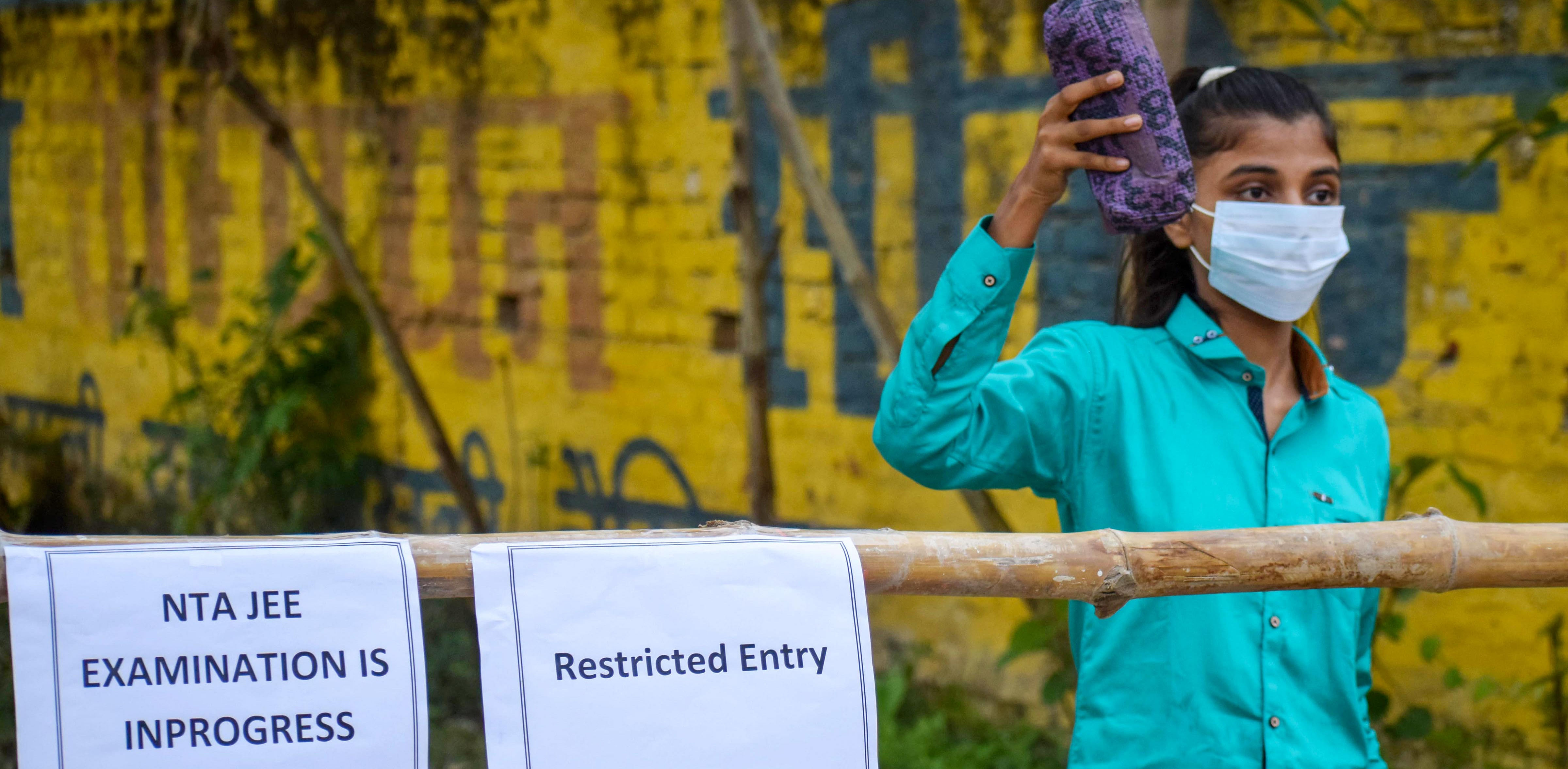 A student at an examination centre to appear for the JEE 2020 entrance papers, amid the ongoing coronavirus pandemic, in Prayagraj. Credit: PTi