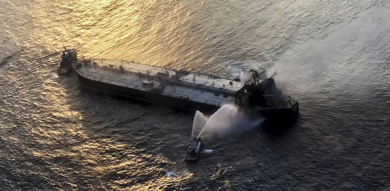 Fireboats battling to extinguish a fire some 60 kms off Sri Lanka's eastern coast. Credits: AFP Photo / Sri Lankan Air Force