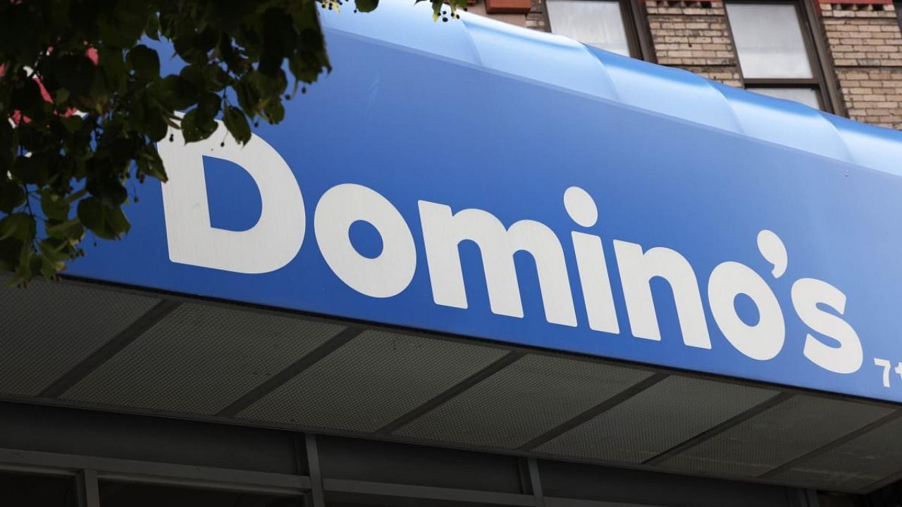 Dominos introduced a new form of delivery and expanded the reach of its GPS-based order tracking, allowing it to survive. Credit: AFP