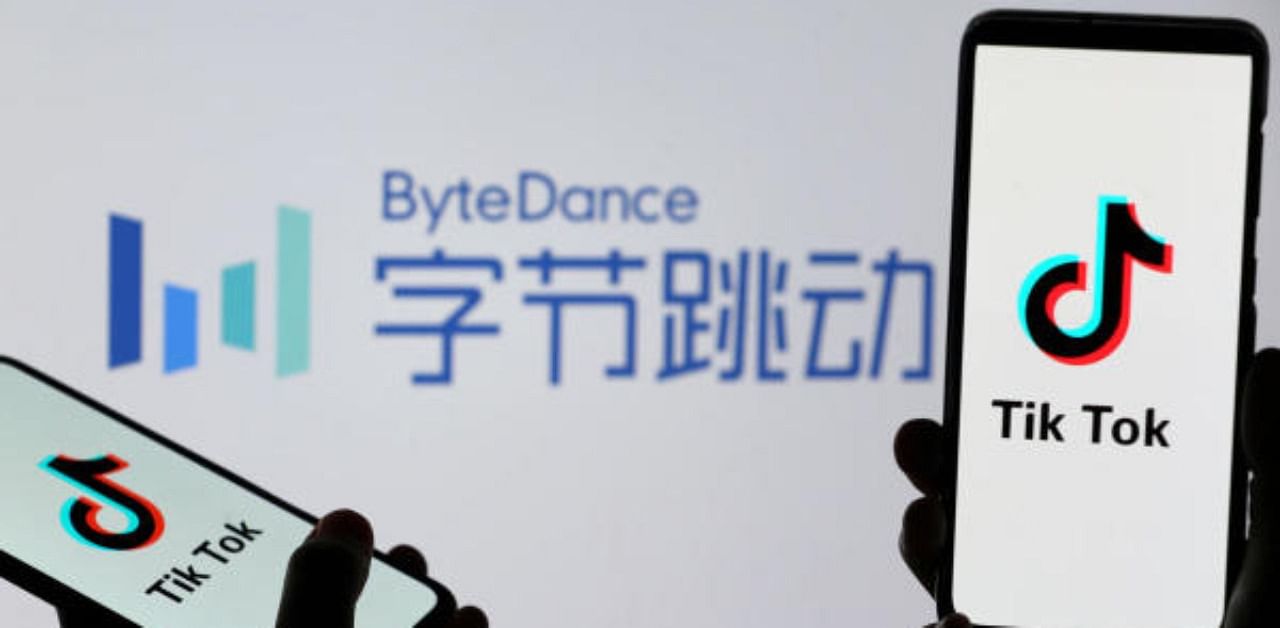 Tik Tok logos are seen on smartphones in front of displayed ByteDance logo. Credit: Reuters