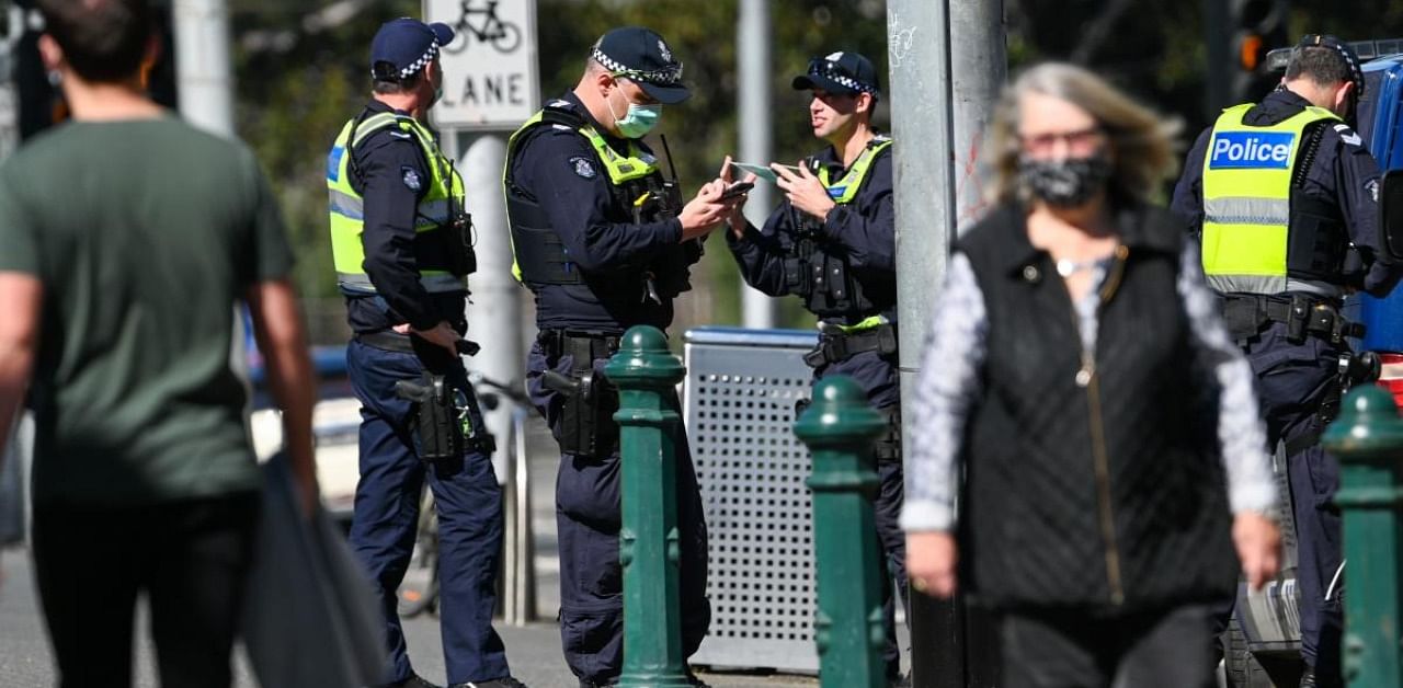 Police patrol a street in Melbourne as the state announced an extension to its strict lockdown law while it battles fresh outbreaks of the Covid-19. Credits: AFP