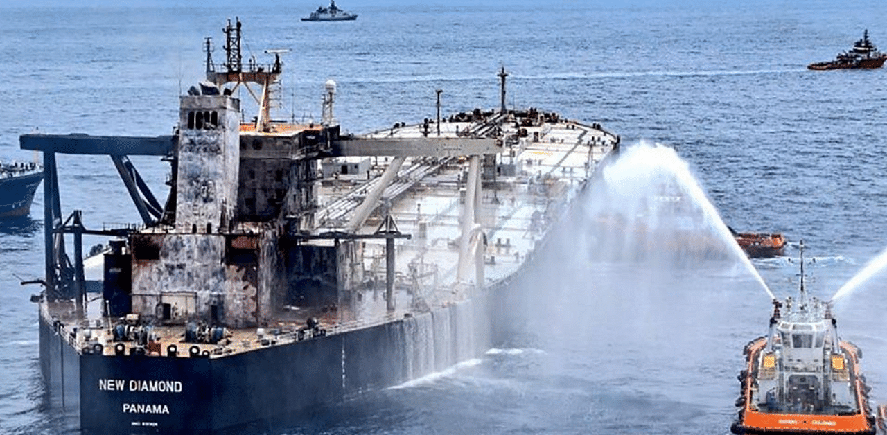 Tug boats and ships battle the fire on MT New Diamond, off the eastern coast of Sri Lanka in the Indian Ocean. The crude carrier chartered by Indian Oil Corp (IOC), caught fire while on its way to port of Paradip in India on Thursday. Credit: PTI Photo