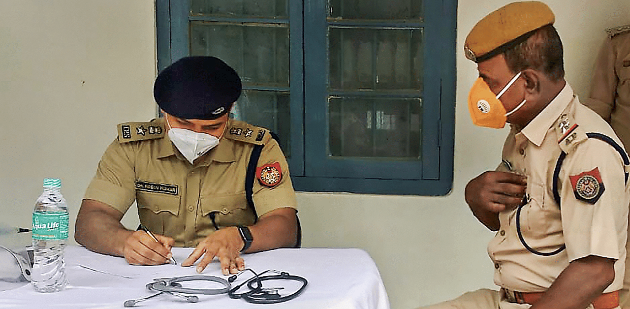 Barpeta Superintendent of Police (SP) Robin Kumar conducts a health check-up in Assam's Barpeta district. Credit: PTI Photo