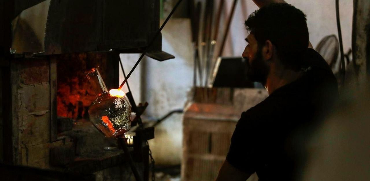 Glass from Beirut blast being used to make jugs. Credit: AFP Photo