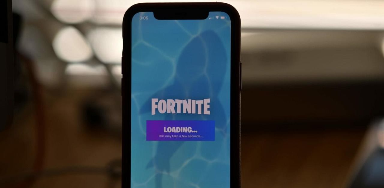 Epic Games' Fortnite loading on a smartphone in Los Angeles. Credits: AFP
