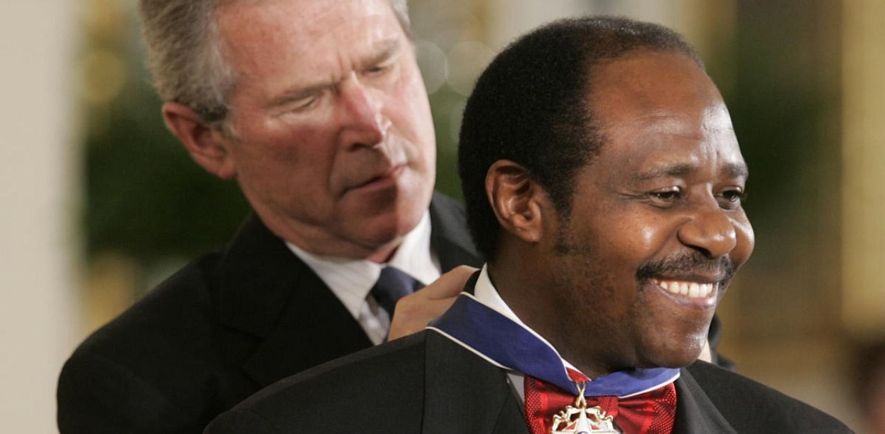 US President Bush awards Paul Rusesabagina, who sheltered people at a hotel he managed during the 1994 Rwandan genocide. Credits: AP