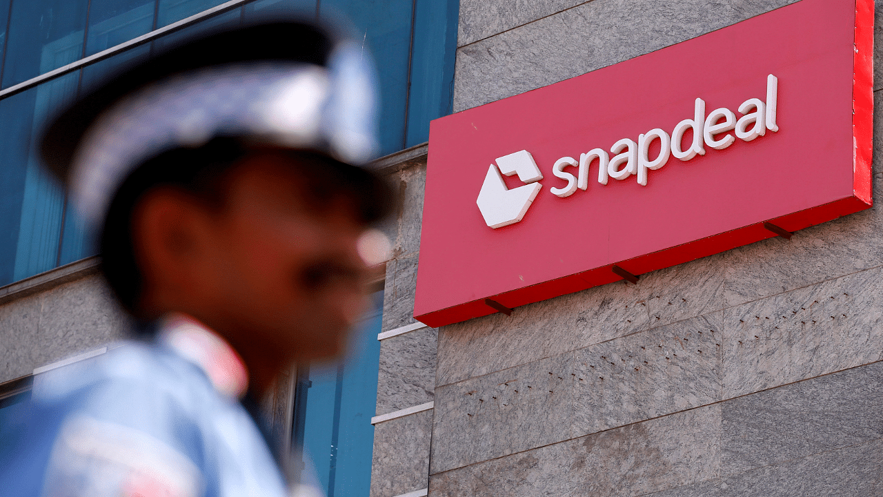 A private security gurad stands at a gate of Snapdeal headquarters in Gurugram. Credits: Reuters Photo
