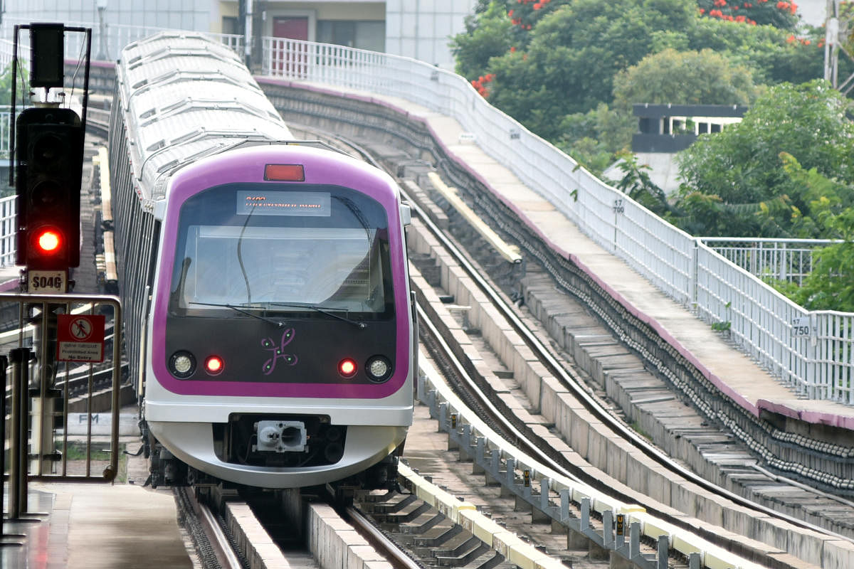 A Purple Line metro train during a test run on Sunday, ahead of the reopening of the services. DH PHOTO/S K DINESH