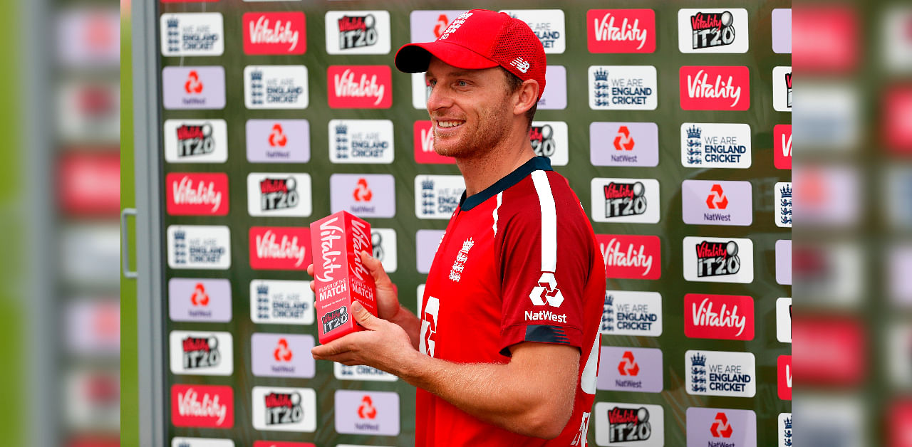 England's Jos Buttler poses with his man of the match award after England's victory in the international Twenty20 cricket match between England and Australia at the Ageas Bowl in Southampton, southern England on September 6, 2020. - Jos Buttler made an unbeaten 77 as England beat Australia by six wickets to seal a series-clinching win in the second Twenty20 international at Southampton on Sunday. Credit: AFP