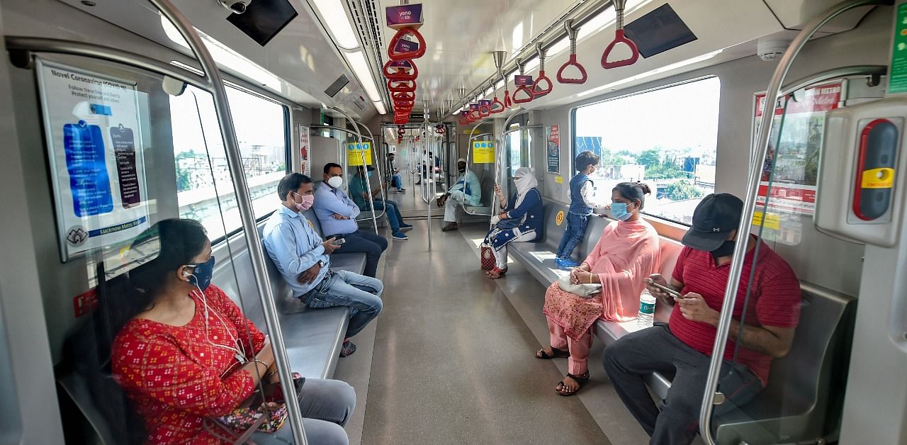 Passengers maintaining physical distance travel in a metro train as Lucknow Metro resumes services after over five months suspension due to Covid-19 outbreak, in Lucknow. Credit: PTI
