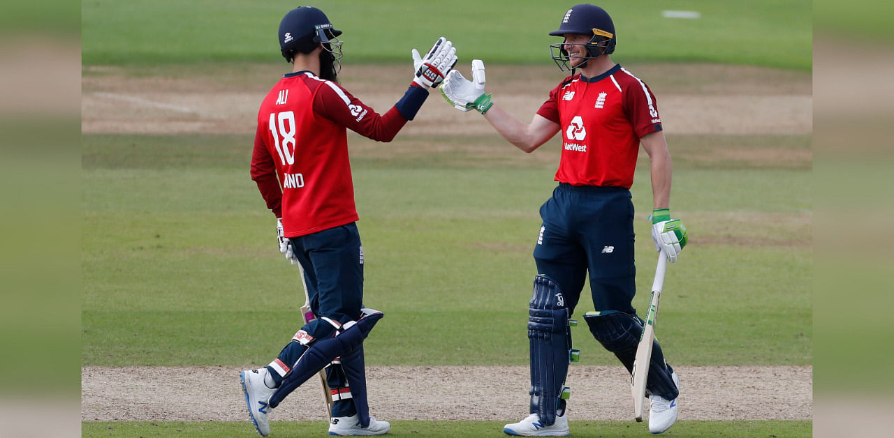 England's Jos Buttler, right, celebrates with batting partner Moeen Ali after their win in the second Twenty20 cricket match between England and Australia, at the Ageas Bowl in Southampton, England, Sunday, Sept. 6, 2020. Credit: AP/PTI 