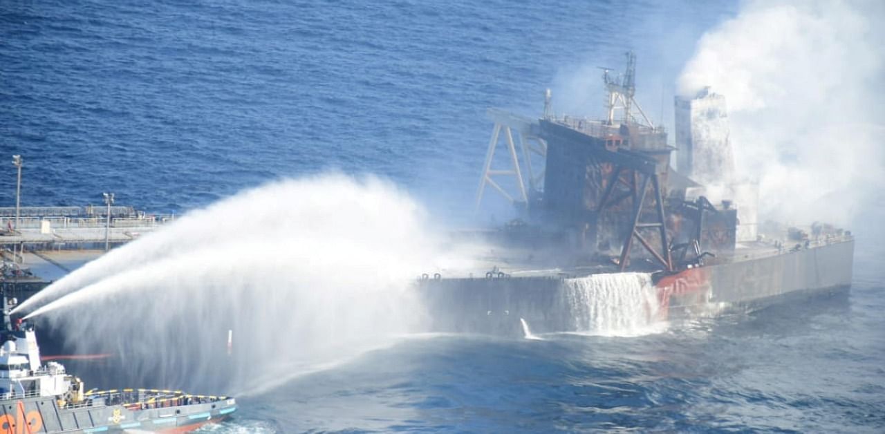 A Sri Lankan Navy boat sprays water on the New Diamond. Credit: Reuters