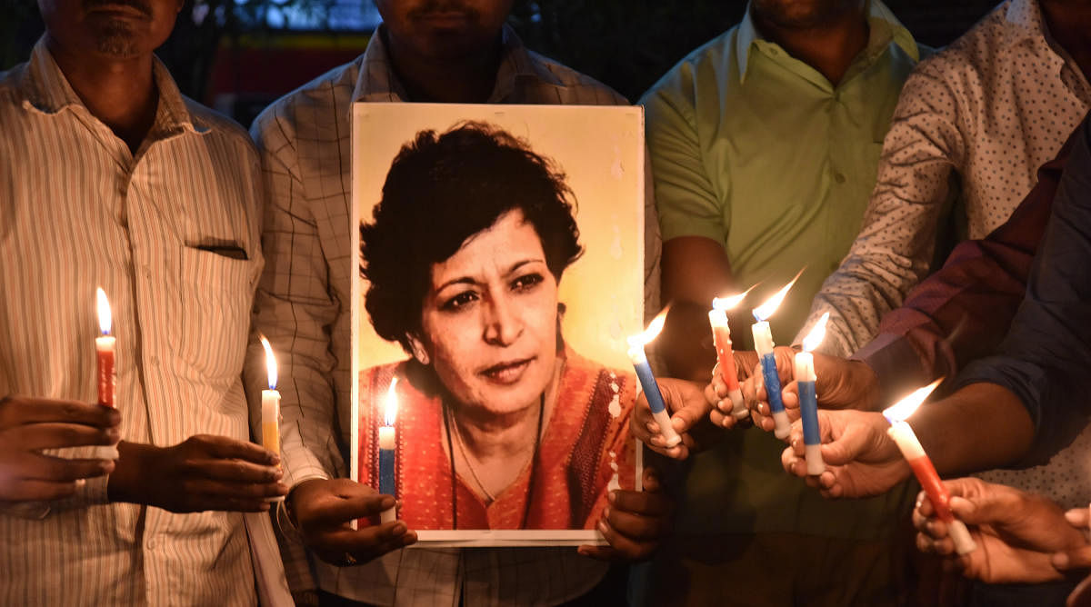 Members from Aam Admi Party staged a candle light Protest condemning the shoot-out on journalist &amp; activist Gauri Lankesh at SVP Circle in Kalaburgi on Wednesday. - Photo/ Prashanth HG