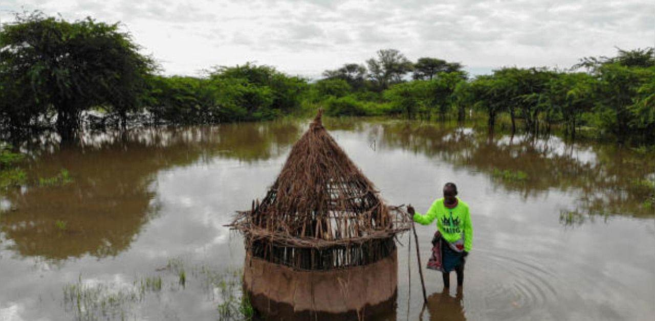 Farmer Parsaalach Nachaki, stands in the field where her house used to stand and is now submerged in rising water due to months of unusually heavy rains in lake Baringo, Kenya. Credit: Reuters
