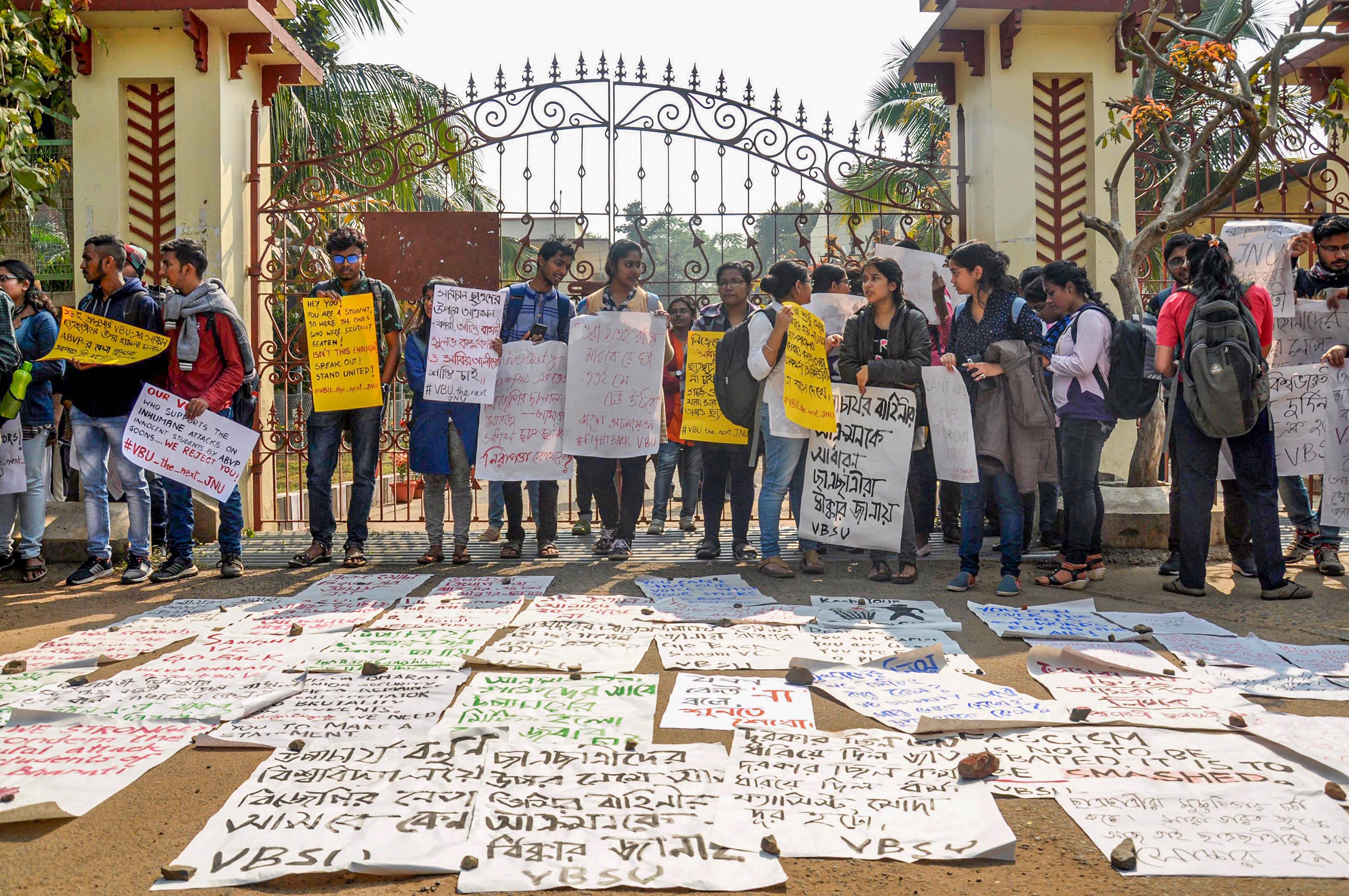 : Left wing students shout slogans outside the central office of Visva-Bharati during a protest against university authorities. Credits: PTI Photo