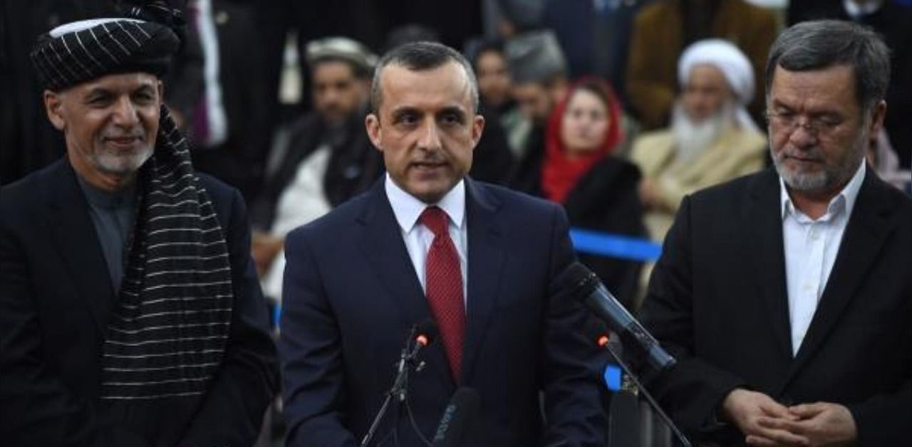 Amrullah Saleh (C) speaks to the media. Credit: AFP