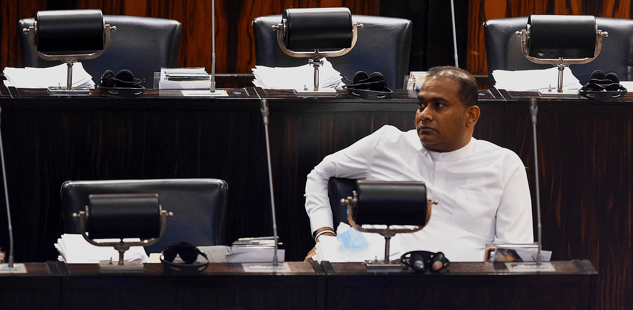 Sri Lanka's convicted murderer Premalal Jayasekara sits after swearing-in as a member of parliament from the ruling party in Colombo. Credit: AFP Photo