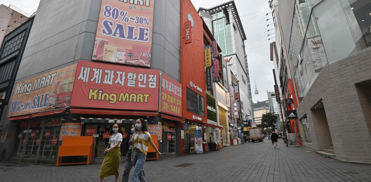 Tough social distancing rules to curb a second wave of coronavirus have markedly slowed retail traffic and emptied cafes across Seoul since mid-August. Credit: AFP Photo