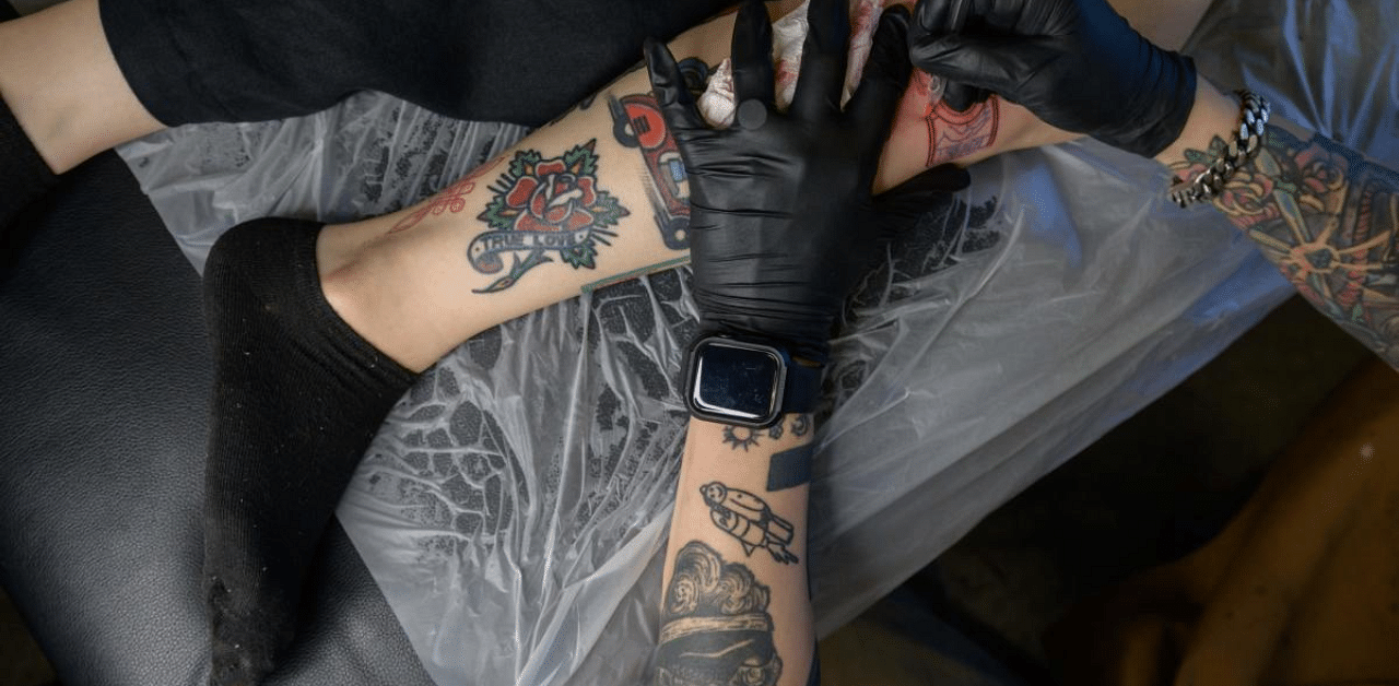While tattooing itself is not illegal, it is classed as a medical procedure and may only be carried out by a fully qualified doctor -- with the law setting a minimum two-year prison sentence for violators. Credit: AFP Photo