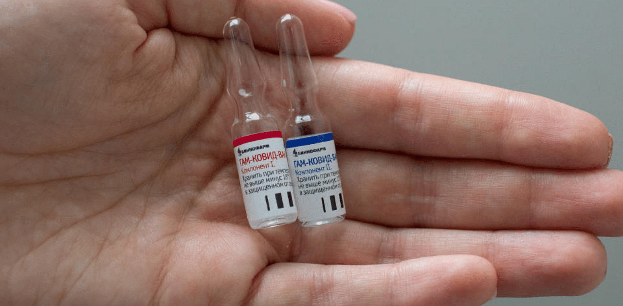 A handout photo shows an employee demonstrating vials with vaccine against the coronavirus disease developed by the Gamaleya National Research Institute of Epidemiology and Microbiology and the Russian Direct Investment Fund (RDIF), during its production at Binnopharm pharmaceutical company in Zelenograd near Moscow, Russia August 7, 2020. Credit: Reuters File photo