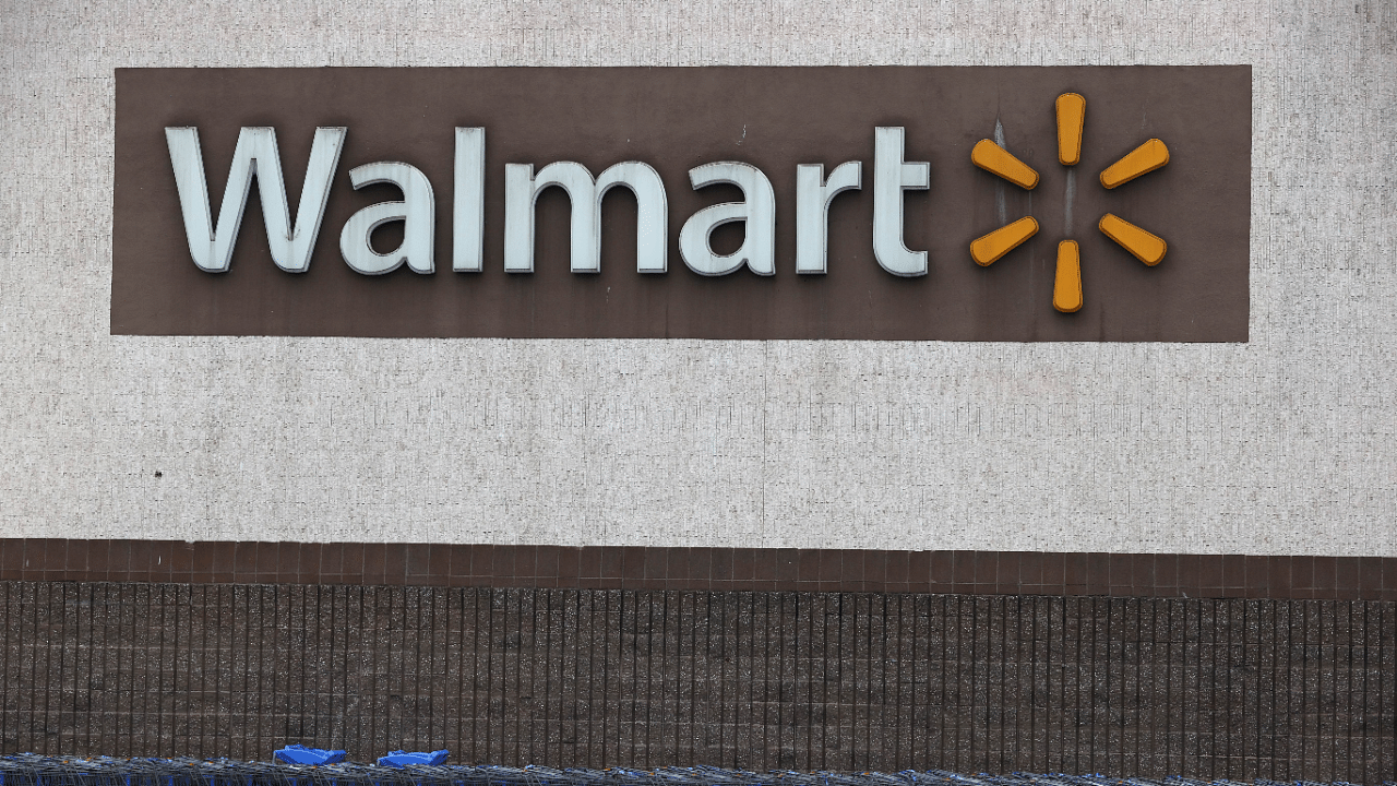 Shopping carts sit in front of a Walmart store. Credits: AFP Photo