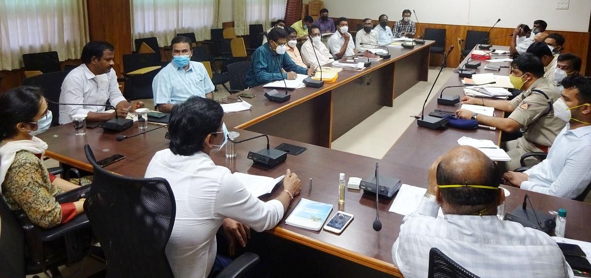 Udupi Deputy Commissioner G Jagadeesha chairs a meeting on National Highway works at his office in Manipal.