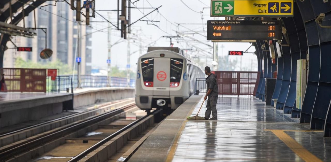A metro train approaches Kaushambi Metro Station after the metro services resumed on Pink and Blue line. Credit: PTI
