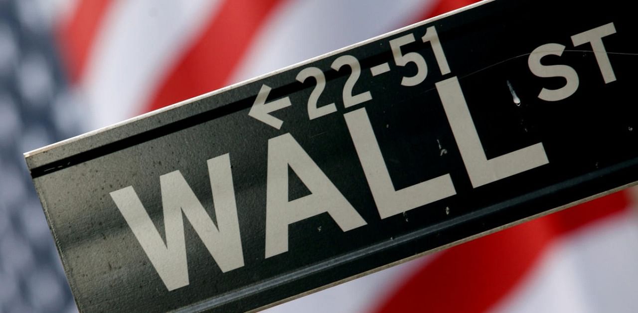 A street sign is seen in front of the New York Stock Exchange on Wall Street in New York. Credit: Reuters