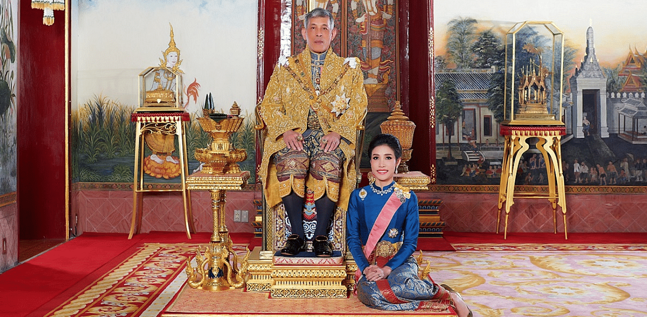 Thailand's King Maha Vajiralongkorn and General Sineenat Wongvajirapakdi, the royal noble consort pose at the Grand Palace in Bangkok, Thailand. Credit: Reuters Photo