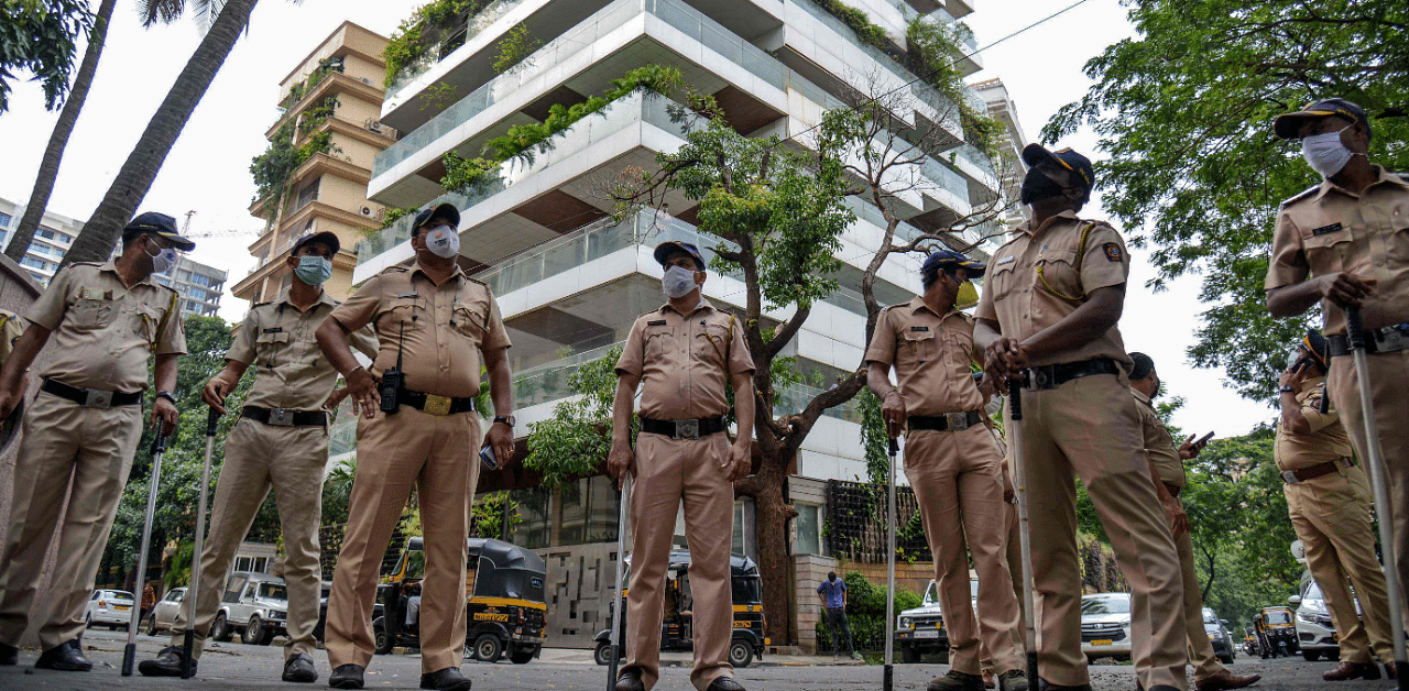Police personnel stand guard near the residence of Bollywood actress Kangana Ranaut. Credit: AFP Photo
