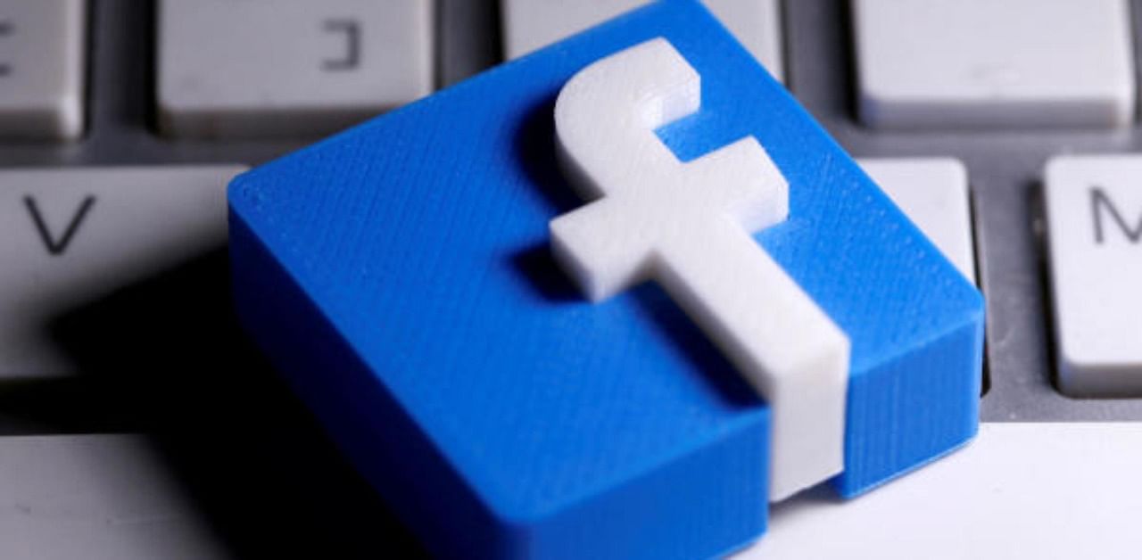 A 3D-printed Facebook logo is seen placed on a keyboard. Representative Photo. Credit: Reuters