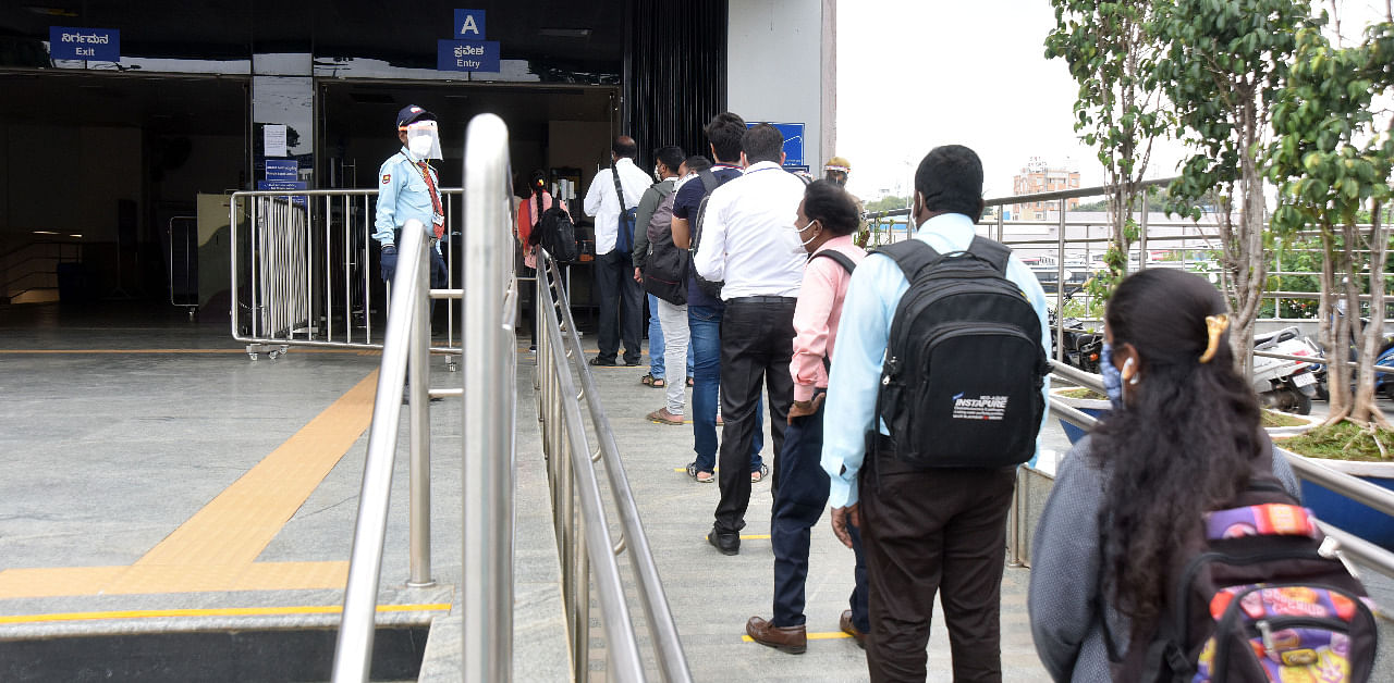 Queue at a metro station in Bengaluru. Credit: DH Photo