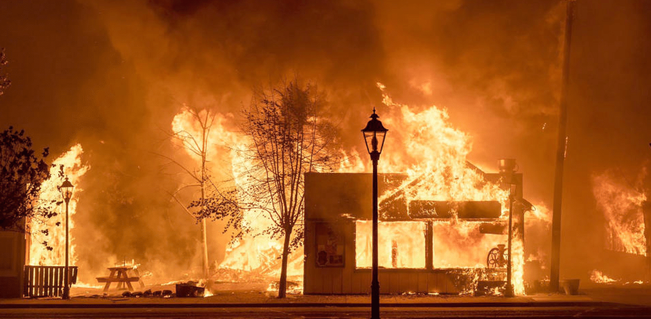 Buildings are engulfed in flames as a wildfire ravages the central Oregon town. Credit: AP