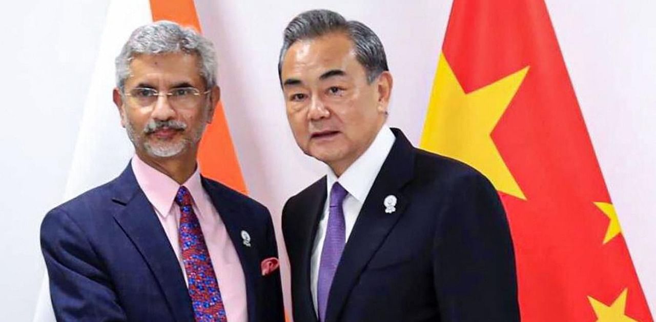 External Affairs Minister S Jaishankar shakes hands with Chinese State Councilor and Foreign Minister Wang Yi during a meeting at ASEAN Thailand 2019, in Bangkok, Thursday, August 1, 2019. Credit: PTI