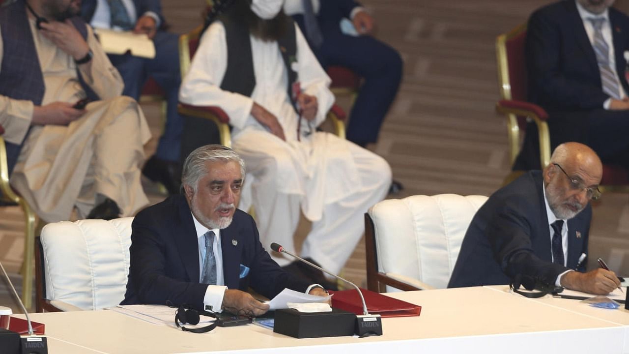 Abdullah Abdullah, left, chairman of Afghanistan's High Council for National Reconciliation, talks at the opening session of the peace talks between the Afghan government and the Taliban in Doha. Credit: AP/PTI