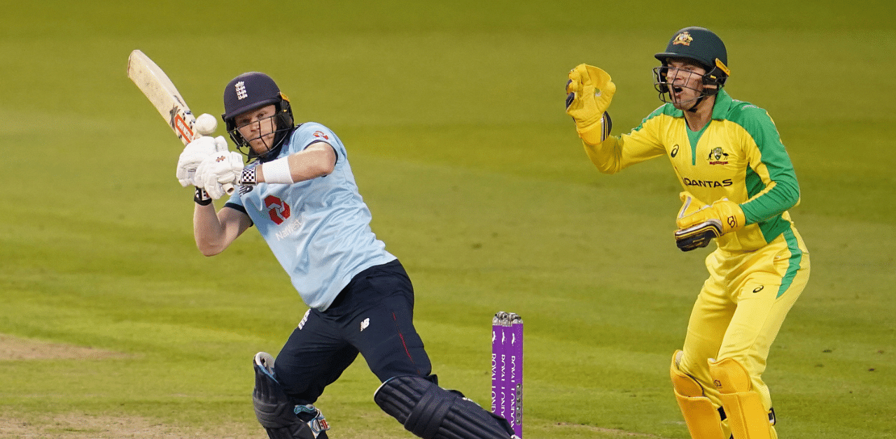 England's Sam Billings, left, plays a shot during the first ODI cricket match between England and Australia. Credit: AP Photo