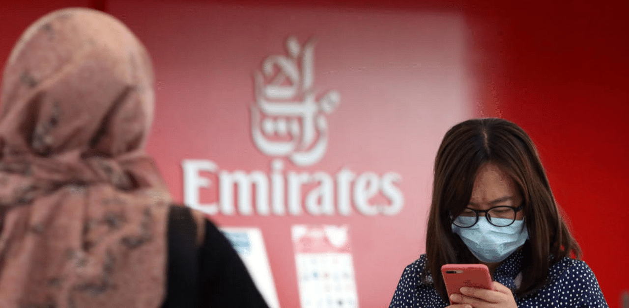 A traveller wears a mask at the Dubai International Airport. Credit: Reuters