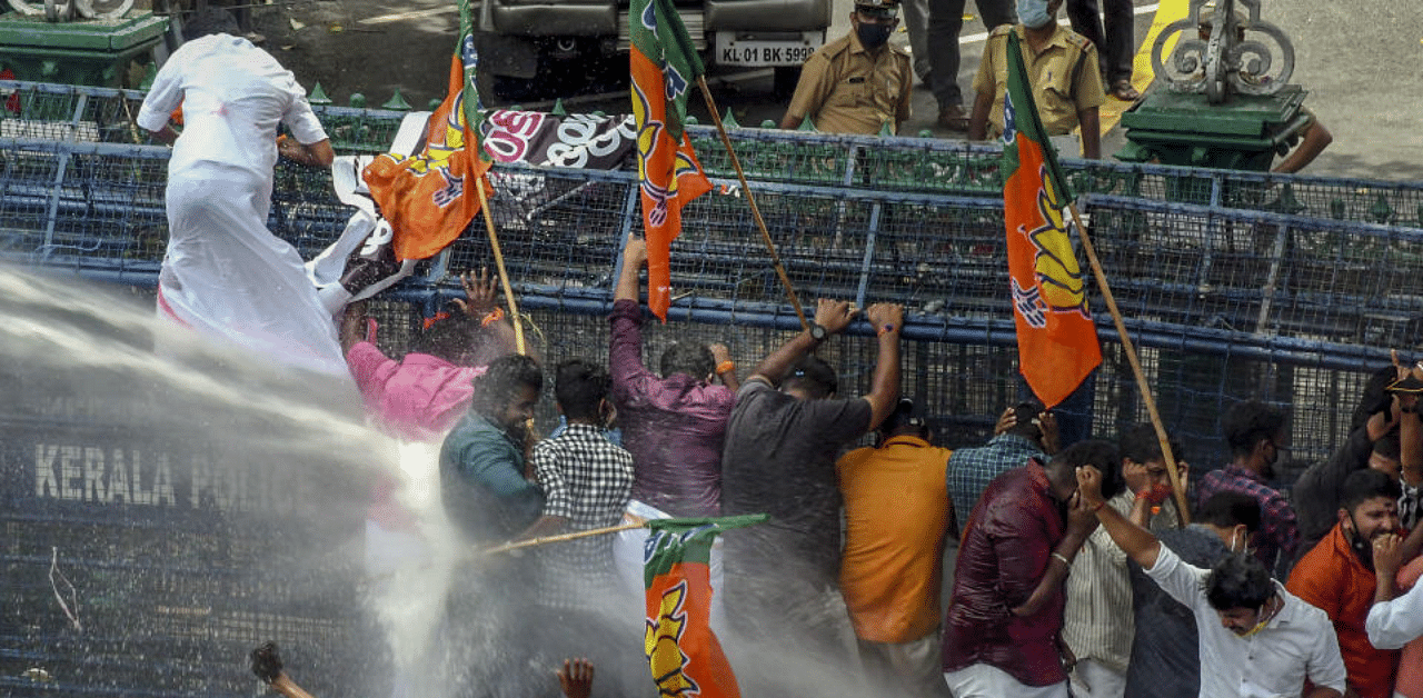 Police use water cannons to disperse BJP Yuva Morcha activists who were staging a protest against Kerala Higher Education Minister KT Jaleel, in Thiruvananthapuram. Credit: PTI