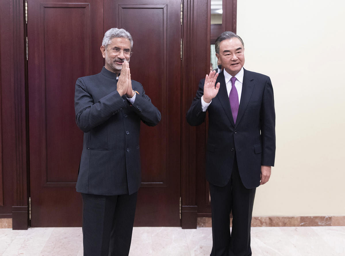 Moscow: In this photo released by China's Xinhua News Agency, India's External Affairs Minister Subrahmanyam Jaishankar, left, and Chinese Foreign Minister Wang Yi pose for a photo as they meet on the sidelines of a meeting of the foreign ministers of the