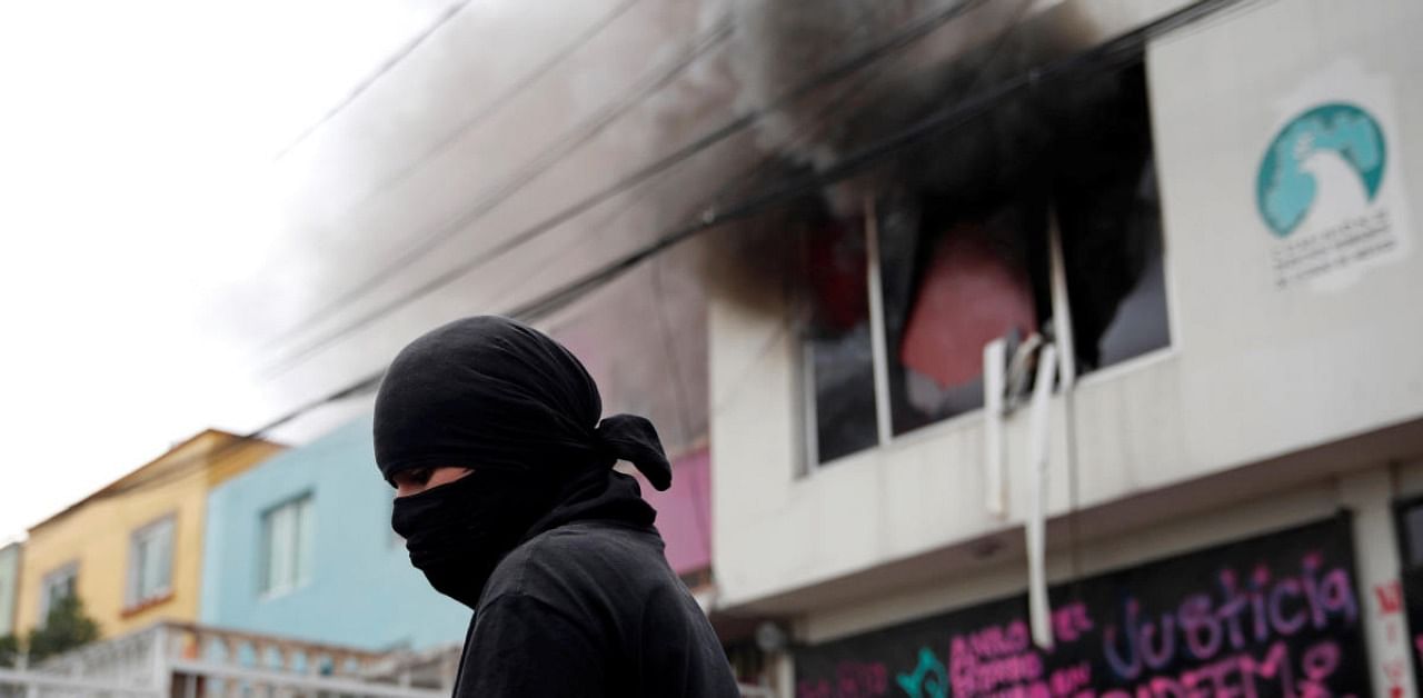 Women's rights activists set fire to building in support of victims of gender violence. Credit: Reuters Photo