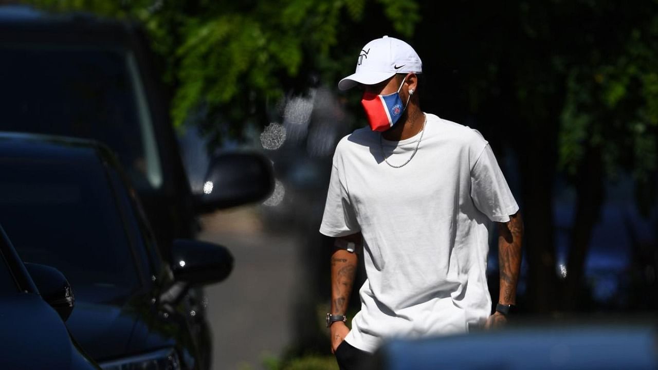 In this file photo taken on June 22, 2020 Paris Saint-Germain's Brazilian forward Neymar arrives at the team's "Camp des Loges" training grounds in Saint-Germain-en-Laye, west of Paris. Credit: AFP