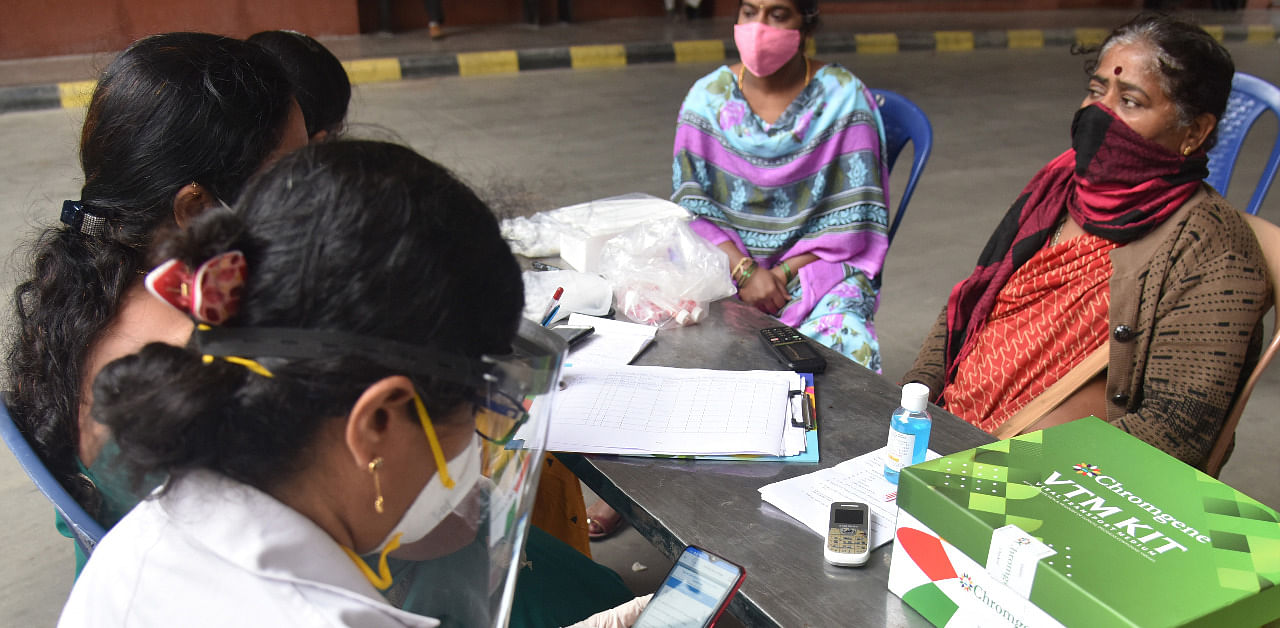 Woman signing up for a test in Bengaluru. Credit: DH Photo