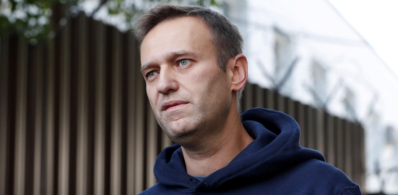 Russian opposition leader Alexei Navalny speaks with journalists after he was released from a detention centre in Moscow. Credit: Reuters