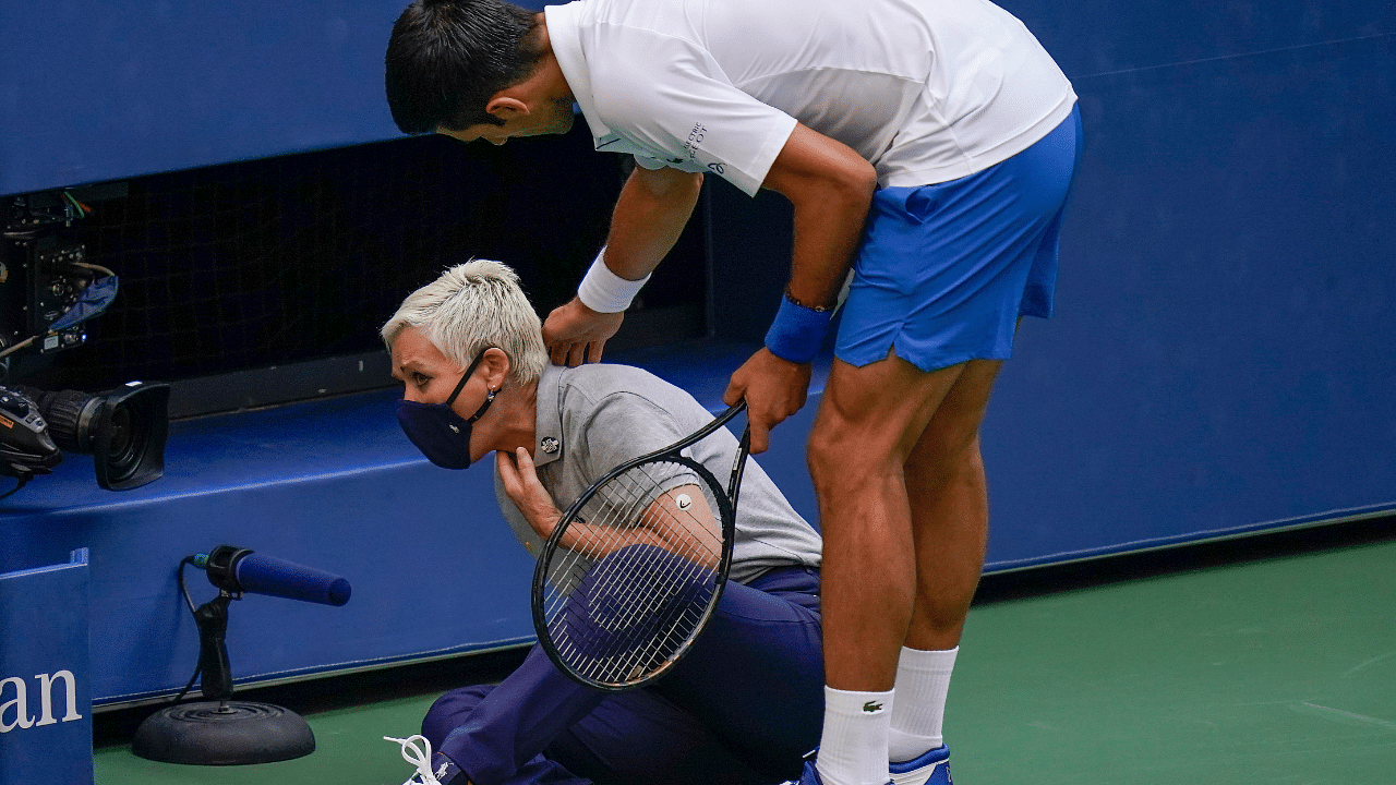 Novak Djokovic, of Serbia, checks a linesman after hitting her with a ball in reaction to losing a point to Pablo Carreno Busta, of Spain, during the fourth round of the US Open tennis. Credits: AFP Photo